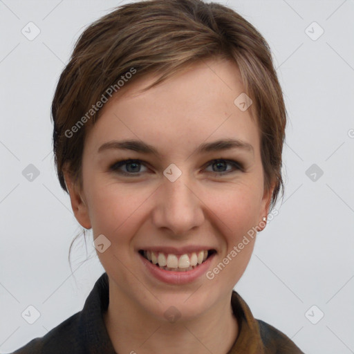 Joyful white young-adult female with short  brown hair and grey eyes