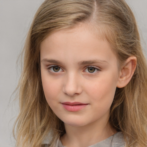 Joyful white child female with long  brown hair and brown eyes