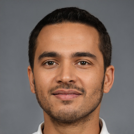 Neutral latino young-adult male with short  black hair and brown eyes