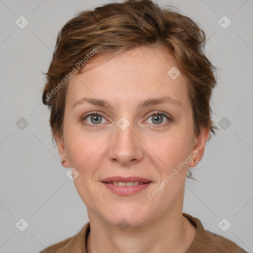 Joyful white adult female with medium  brown hair and blue eyes