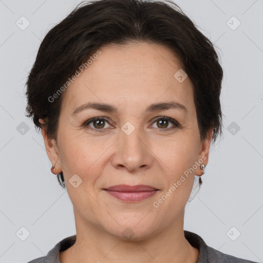 Joyful white adult female with medium  brown hair and brown eyes