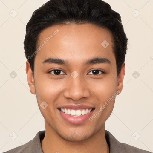 Joyful latino young-adult male with short  black hair and brown eyes