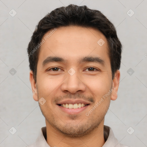 Joyful white young-adult male with short  black hair and brown eyes