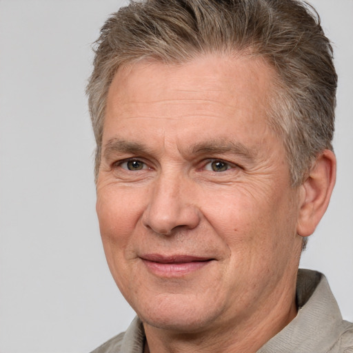 Joyful white middle-aged male with short  brown hair and brown eyes