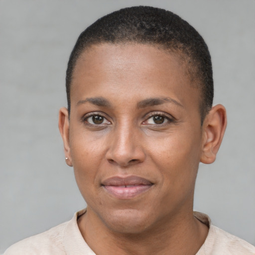 Joyful black adult female with short  brown hair and brown eyes