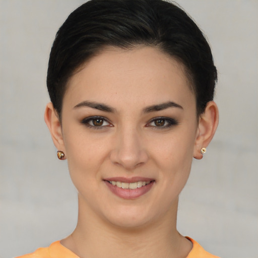 Joyful white young-adult female with short  brown hair and brown eyes