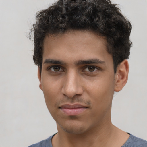 Neutral latino young-adult male with short  brown hair and brown eyes