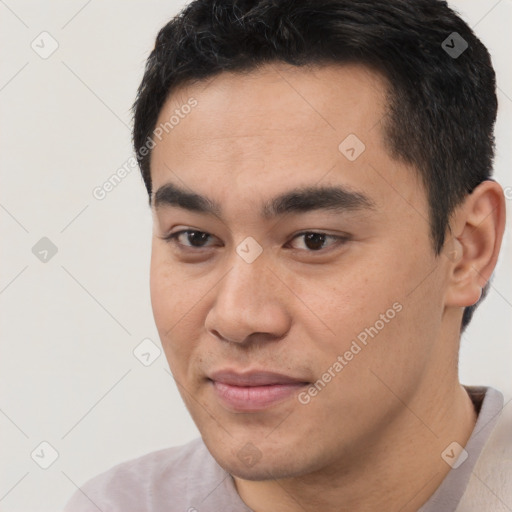 Joyful white young-adult male with short  black hair and brown eyes