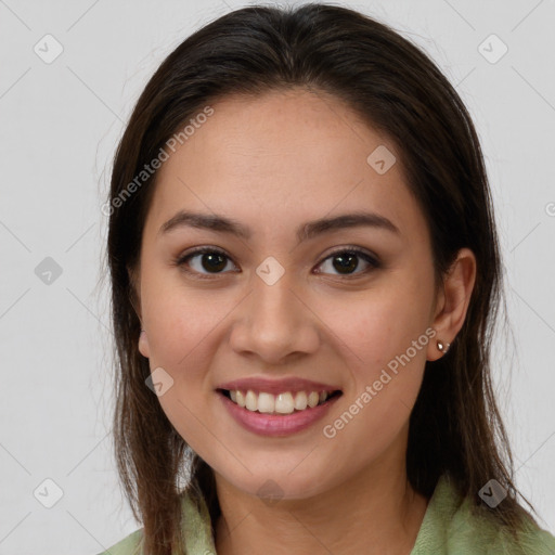 Joyful white young-adult female with long  brown hair and brown eyes