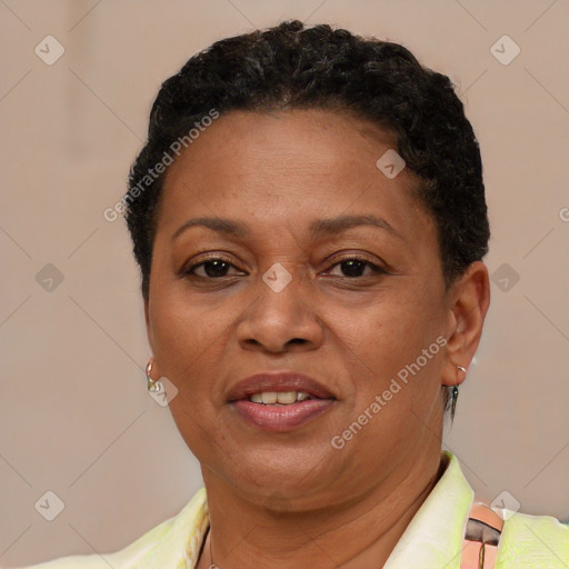 Joyful latino adult female with short  brown hair and brown eyes