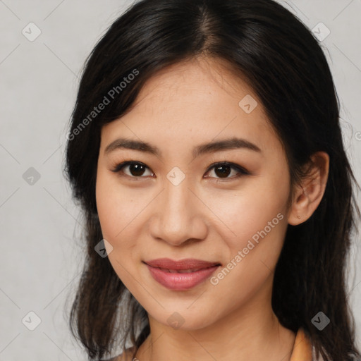 Joyful latino young-adult female with long  brown hair and brown eyes