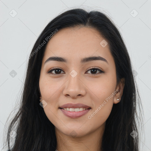 Joyful latino young-adult female with long  brown hair and brown eyes