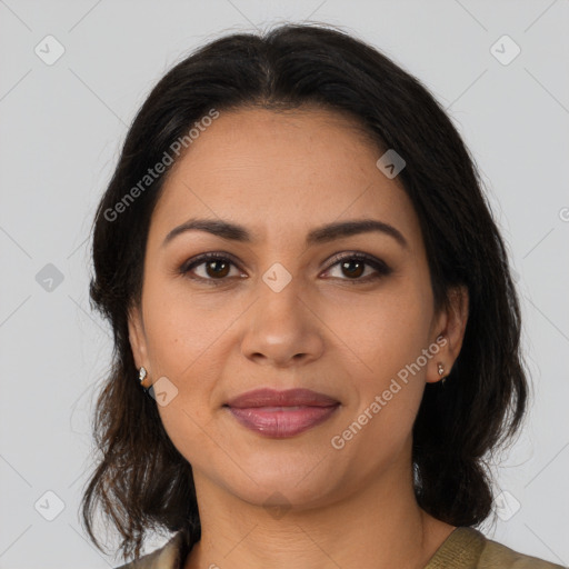 Joyful latino young-adult female with medium  brown hair and brown eyes