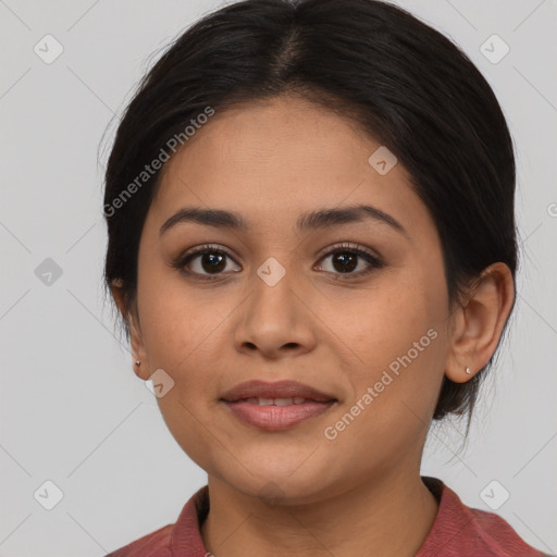 Joyful latino young-adult female with medium  brown hair and brown eyes