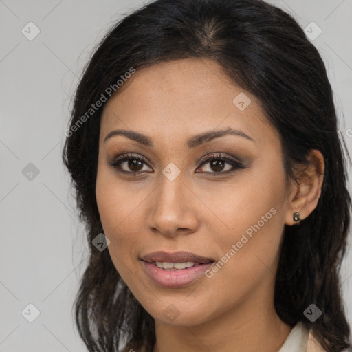 Joyful latino young-adult female with long  brown hair and brown eyes