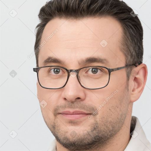 Neutral white young-adult male with short  brown hair and brown eyes