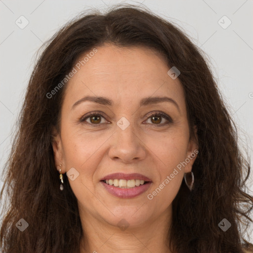 Joyful white adult female with long  brown hair and brown eyes