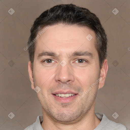 Joyful white adult male with short  brown hair and brown eyes