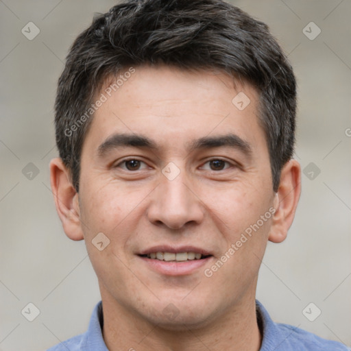 Joyful white adult male with short  brown hair and brown eyes