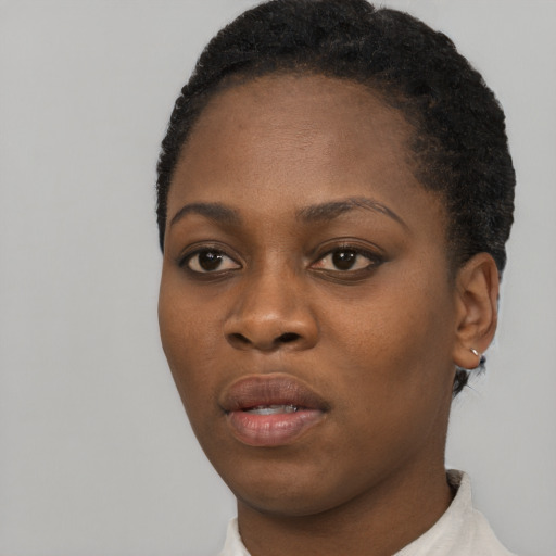 Neutral black young-adult female with short  black hair and brown eyes