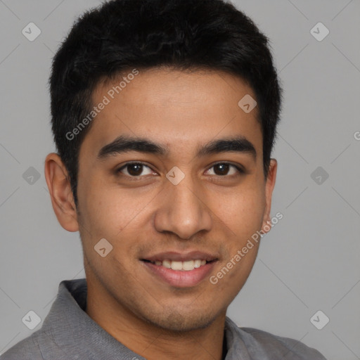 Joyful latino young-adult male with short  brown hair and brown eyes