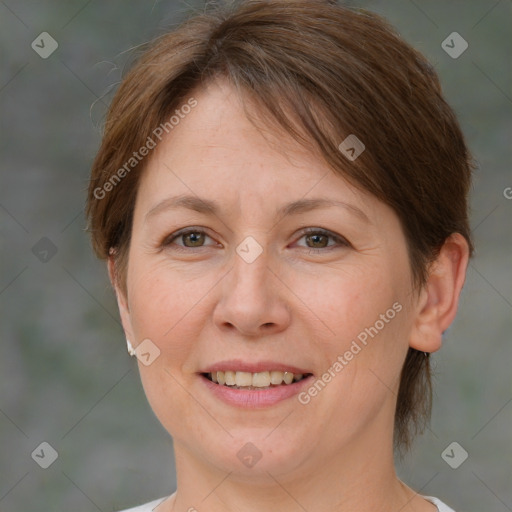 Joyful white adult female with medium  brown hair and brown eyes