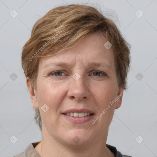 Joyful white adult female with short  brown hair and grey eyes