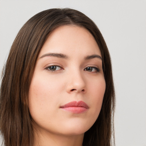 Neutral white young-adult female with long  brown hair and brown eyes