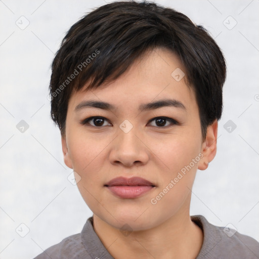 Joyful asian young-adult female with short  black hair and brown eyes