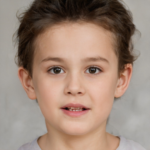 Joyful white child female with short  brown hair and brown eyes