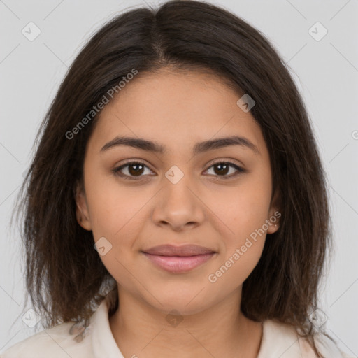 Joyful latino young-adult female with medium  brown hair and brown eyes