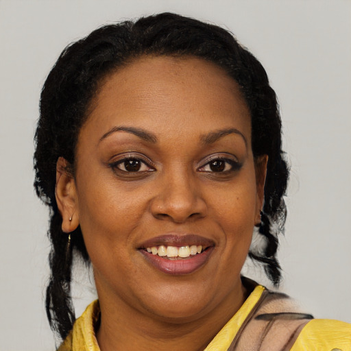 Joyful latino adult female with medium  brown hair and brown eyes