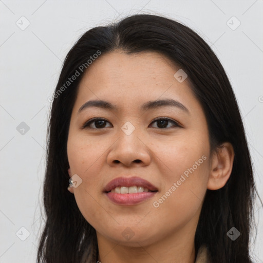 Joyful asian young-adult female with long  brown hair and brown eyes