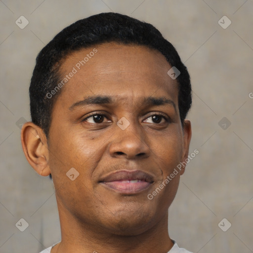 Joyful black young-adult male with short  black hair and brown eyes