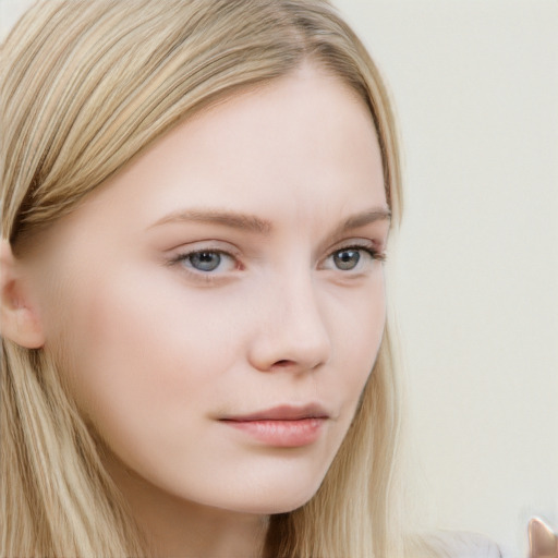 Neutral white young-adult female with long  brown hair and blue eyes