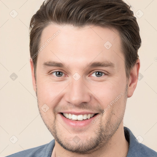 Joyful white young-adult male with short  brown hair and brown eyes