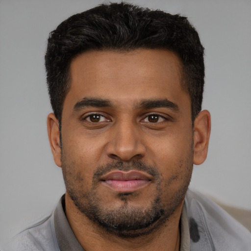 Neutral black young-adult male with short  brown hair and brown eyes