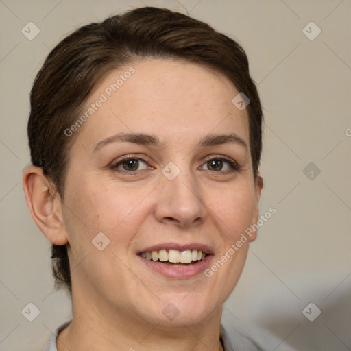 Joyful white adult female with short  brown hair and grey eyes