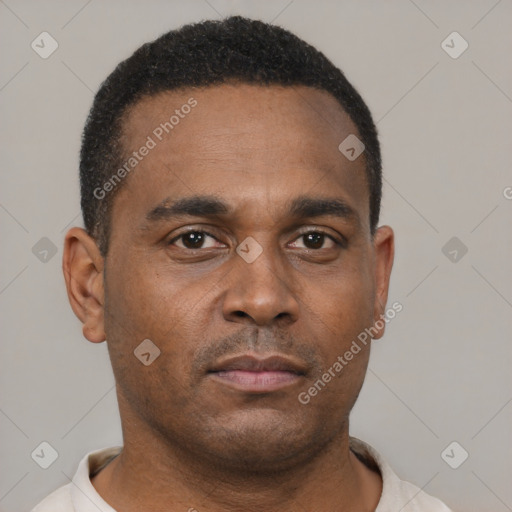 Neutral latino young-adult male with short  brown hair and brown eyes