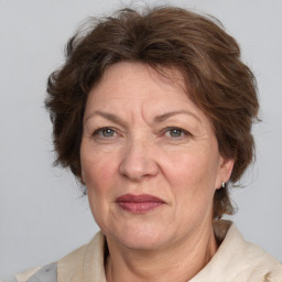 Joyful white middle-aged female with medium  brown hair and brown eyes