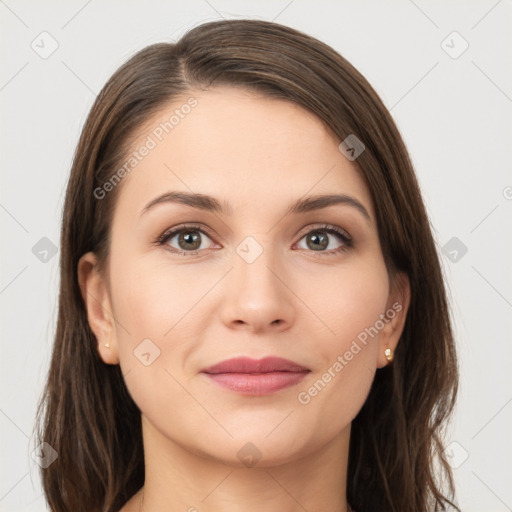 Joyful white young-adult female with long  brown hair and grey eyes