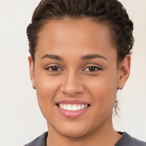 Joyful white young-adult female with short  brown hair and brown eyes