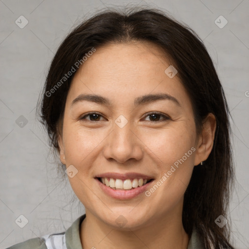 Joyful asian young-adult female with medium  brown hair and brown eyes