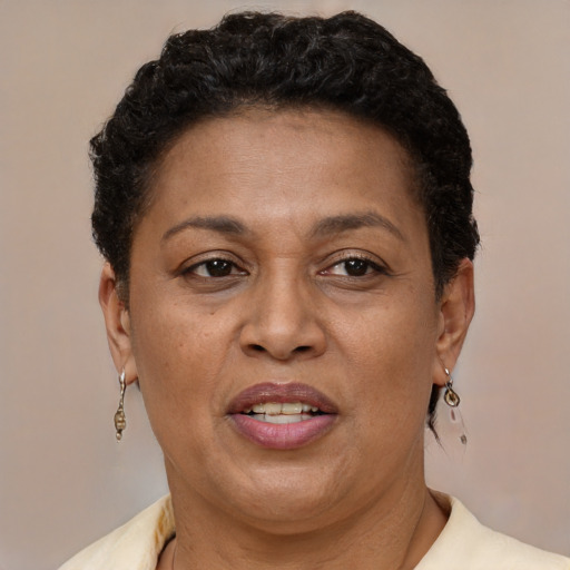 Joyful latino adult female with short  brown hair and brown eyes