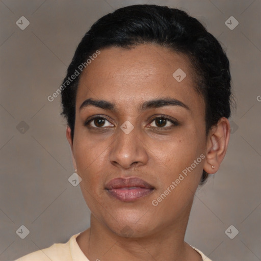 Joyful latino young-adult female with short  black hair and brown eyes