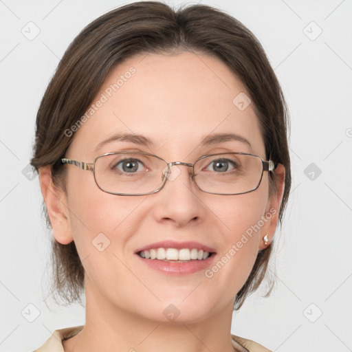 Joyful white adult female with medium  brown hair and grey eyes