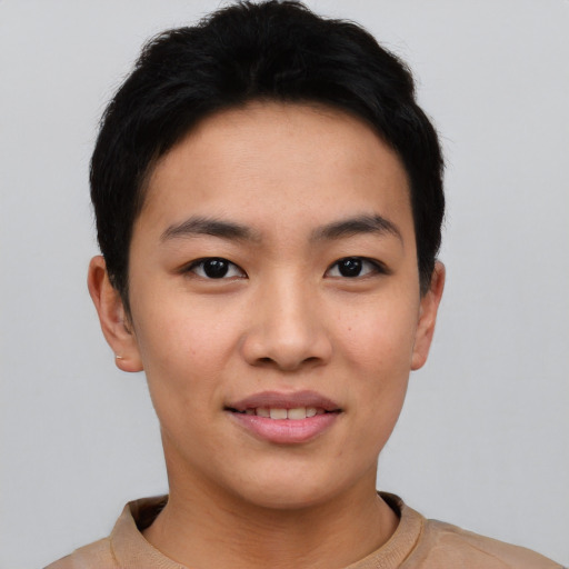 Joyful asian young-adult female with short  black hair and brown eyes