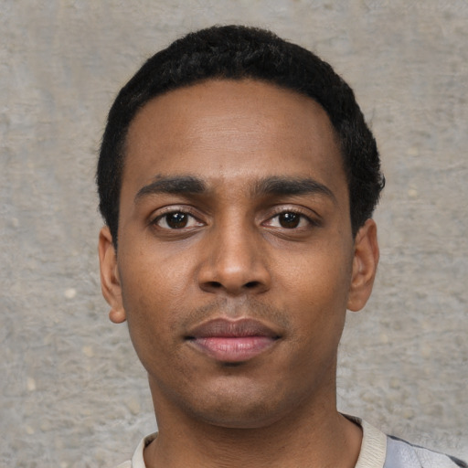 Neutral black young-adult male with short  black hair and brown eyes