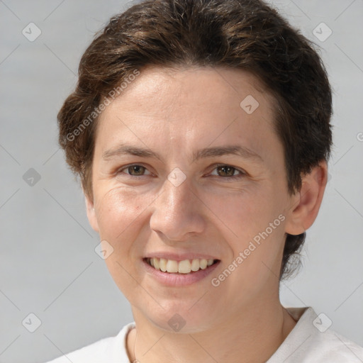 Joyful white young-adult female with short  brown hair and grey eyes