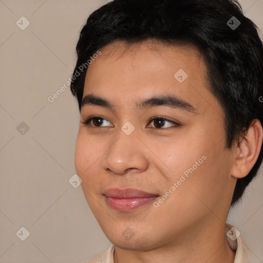 Joyful asian young-adult male with short  black hair and brown eyes